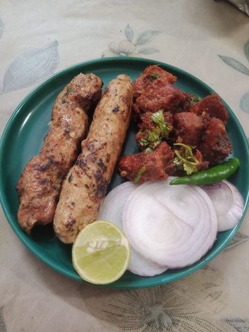 Representative photograph of Beef Seekh Kebab. The photograph includes beef boti kebab beside the seekh kebab; this draft makes seekh kebabs only.