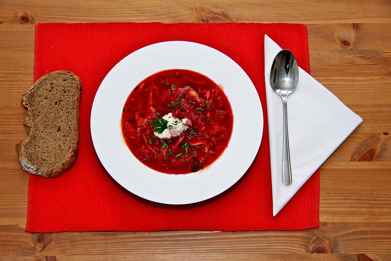 Representative photograph of Borscht. The photograph includes bread not included in this draft.
