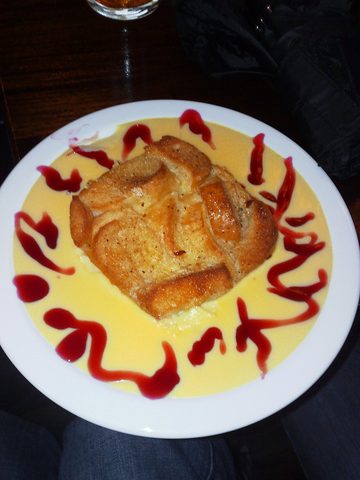 Representative photograph of Bread and Butter Pudding. The photograph includes custard and fruit sauce not included in this draft.