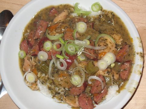 Representative photograph of Chicken and Sausage Gumbo. The photograph includes spring onion garnish not included in this draft.