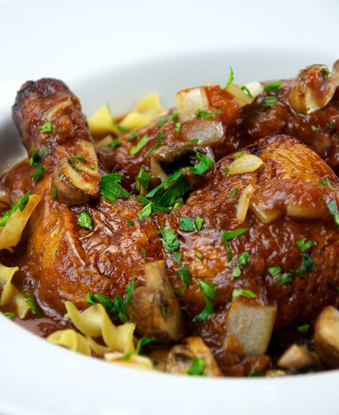 Representative photograph of Chicken Cacciatore. The photograph includes pasta not included in this draft.