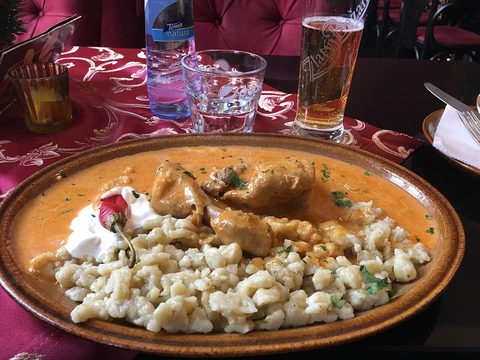 Representative photograph of Chicken Paprikash. The photograph includes spaetzle not included in this draft.