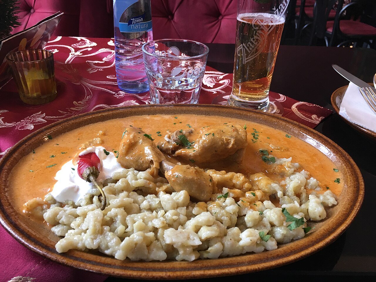 Representative photograph of Chicken Paprikash. The photograph includes spaetzle not included in this draft.
