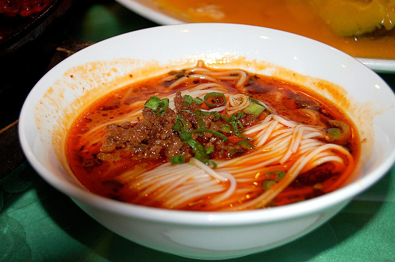 Representative photograph of Dan Dan Noodles. The photograph shows a brothier serving than this sesame-sauce draft.