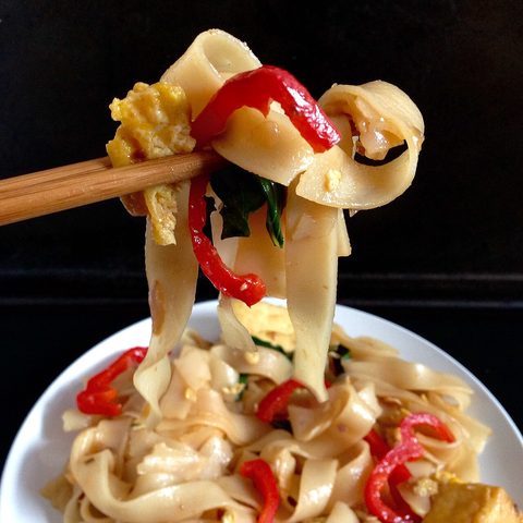 Representative photograph of Drunken Noodles. The photograph shows one lifted portion; the vegetables may differ from this draft.