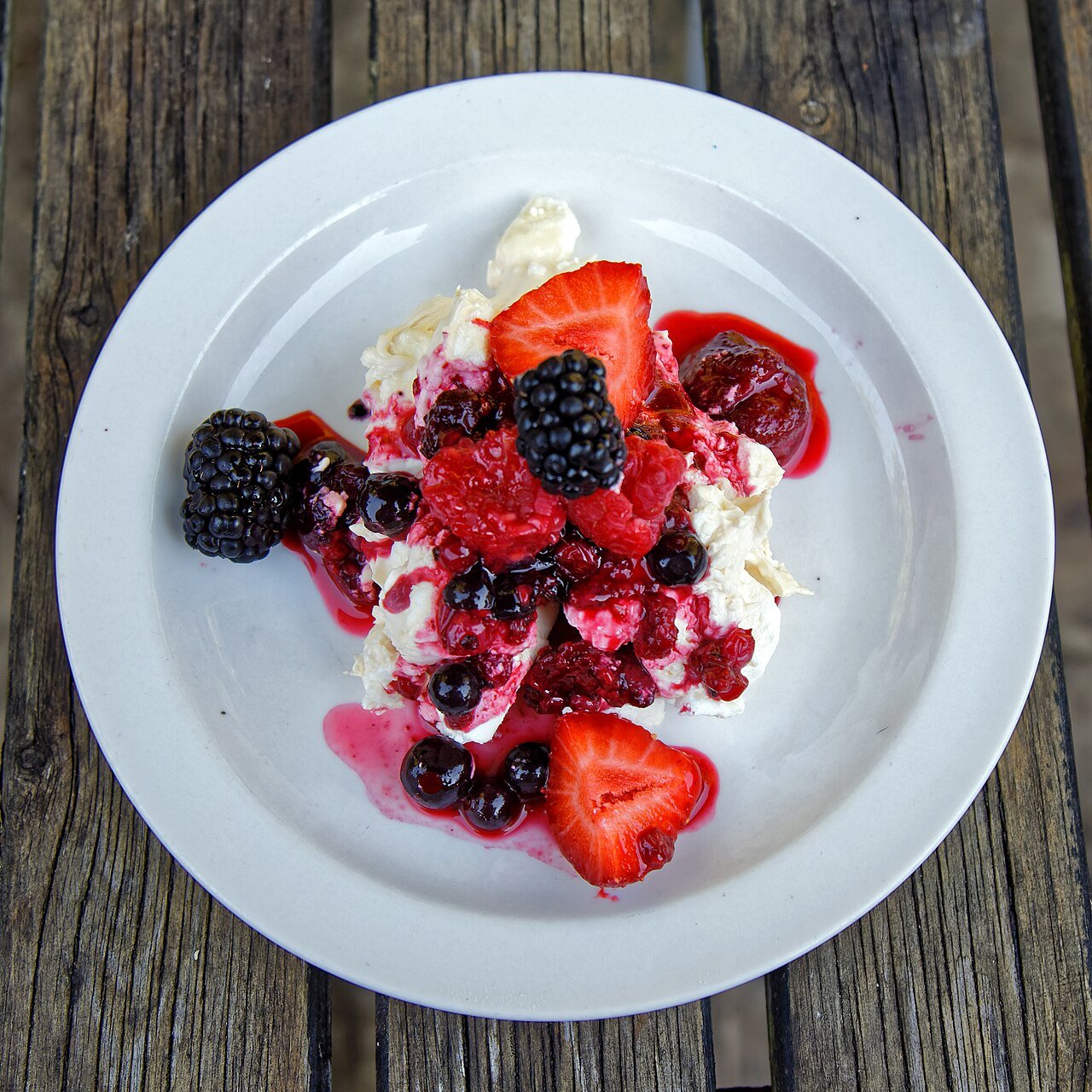 Representative photograph of Eton Mess. The photograph uses mixed berries; this draft uses strawberries.
