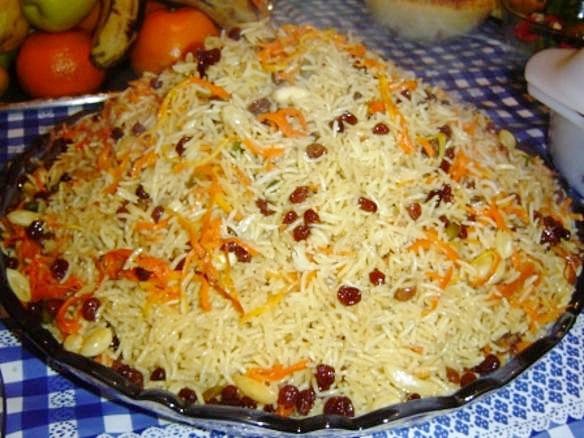 Representative photograph of Kabuli Pulao. The source identifies Afghan palaw but does not establish the meat variety. This draft uses lamb.