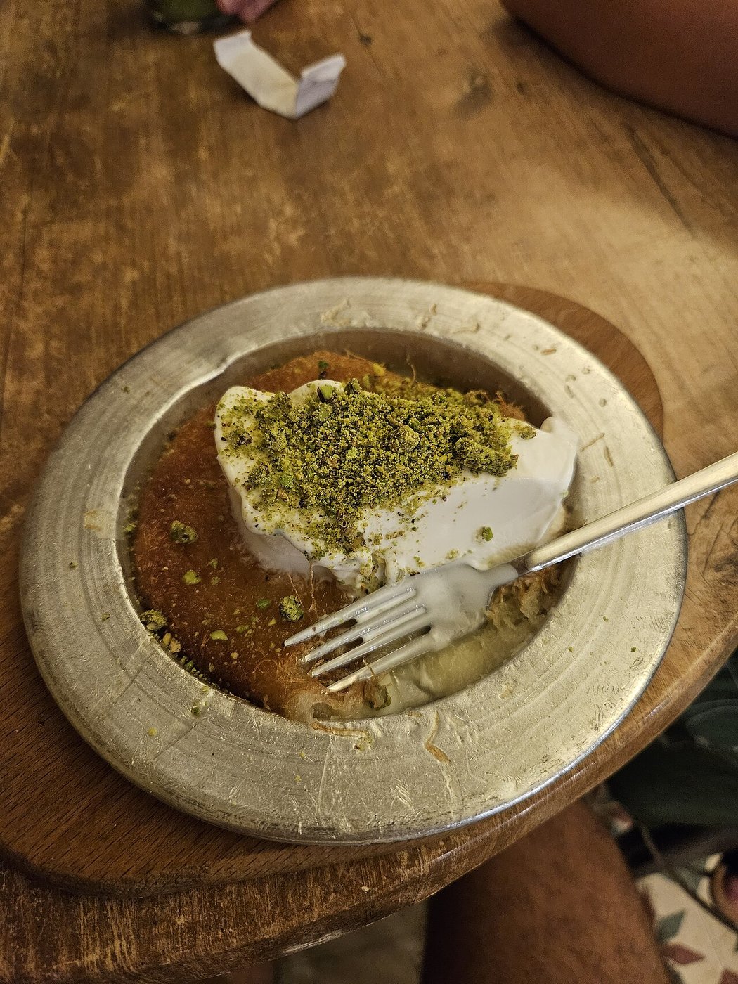 Representative photograph of Knafeh. The photograph includes a cream topping that is not part of this draft.