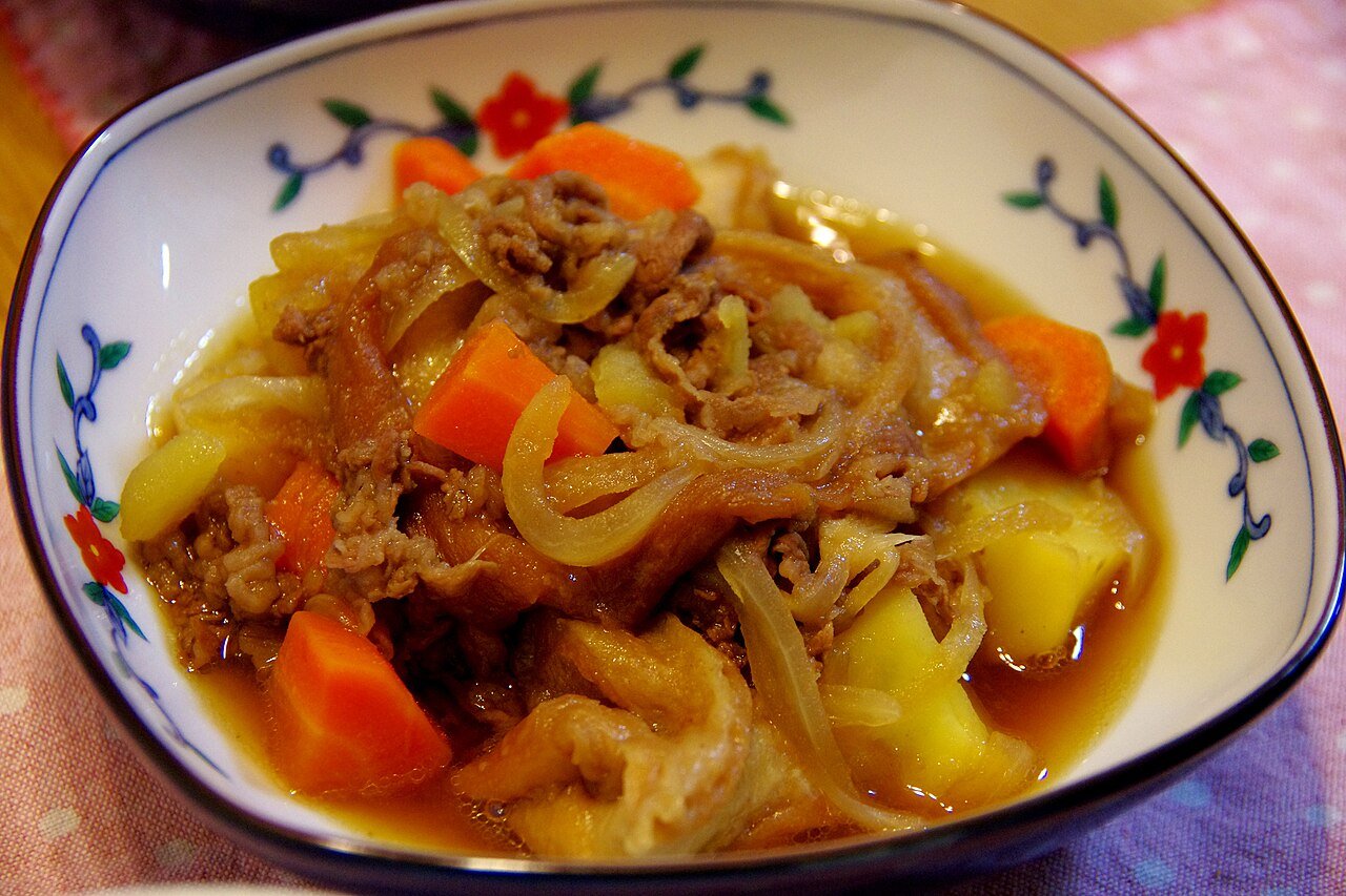 Representative photograph of Nikujaga. The photograph uses a different vegetable mix from this beef-and-potato draft.