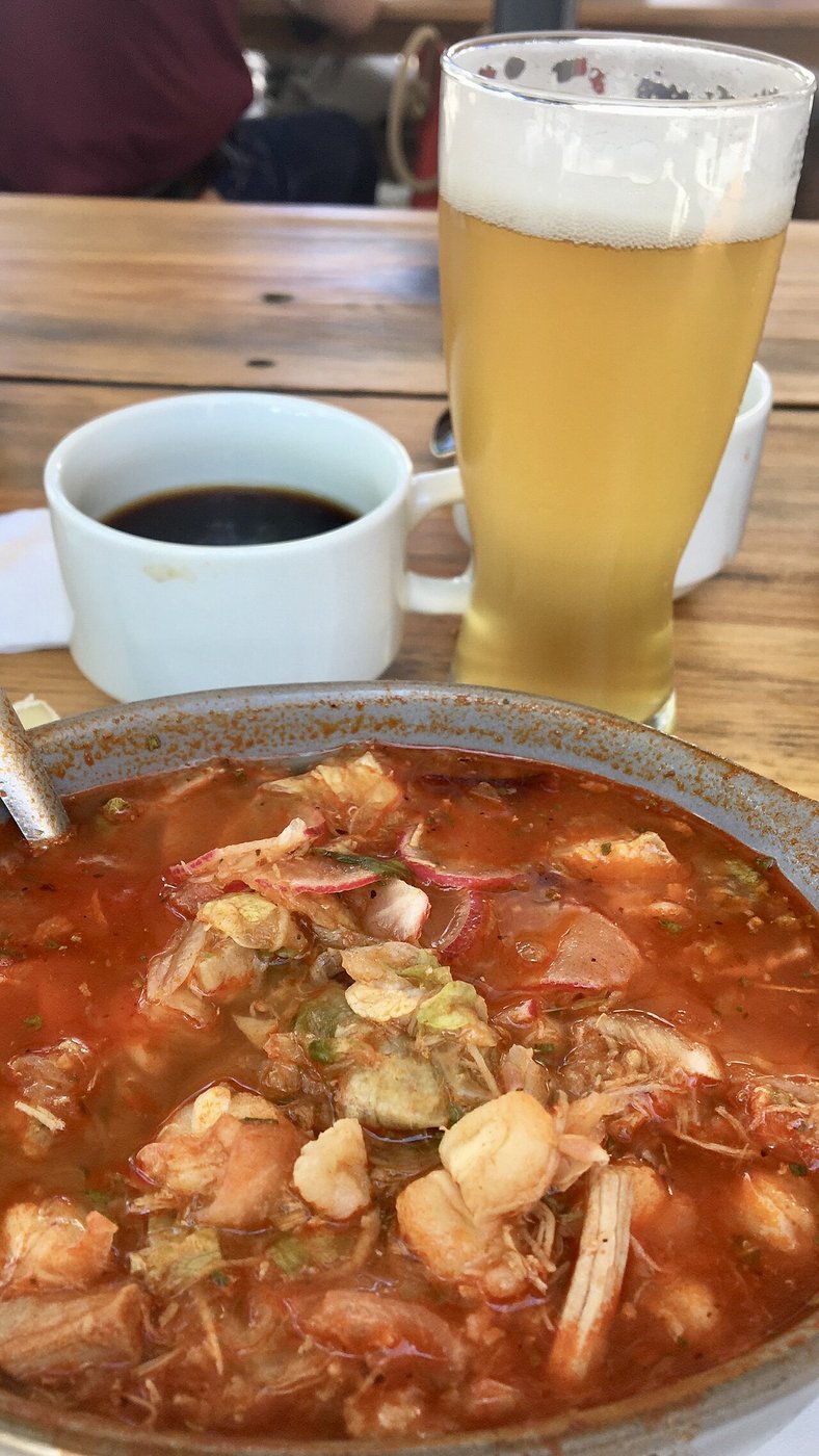 Representative photograph of Pozole Rojo. The photograph includes a drink not included in this draft.