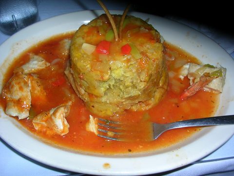 Representative photograph of Puerto Rican Mofongo. The photograph includes a meat sauce not included in this mofongo draft.