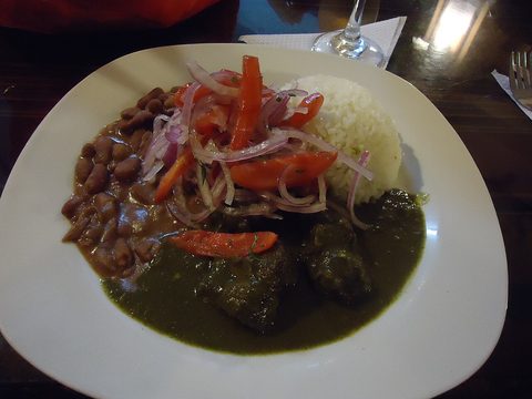 Representative photograph of Seco de Res. The photograph includes rice, beans and onion garnish not included in this draft.