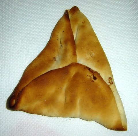 Representative photograph of Sfeeha. The photograph shows closed triangular sfeeha; this draft makes open meat-topped rounds.