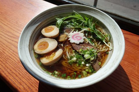 Representative photograph of Shoyu Ramen. The photograph includes egg, fish cake and other toppings that differ from the chicken toppings in this draft.