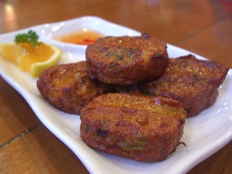 Representative photograph of Thai Fish Cakes. The photo includes dipping sauce and garnish not included in this draft.