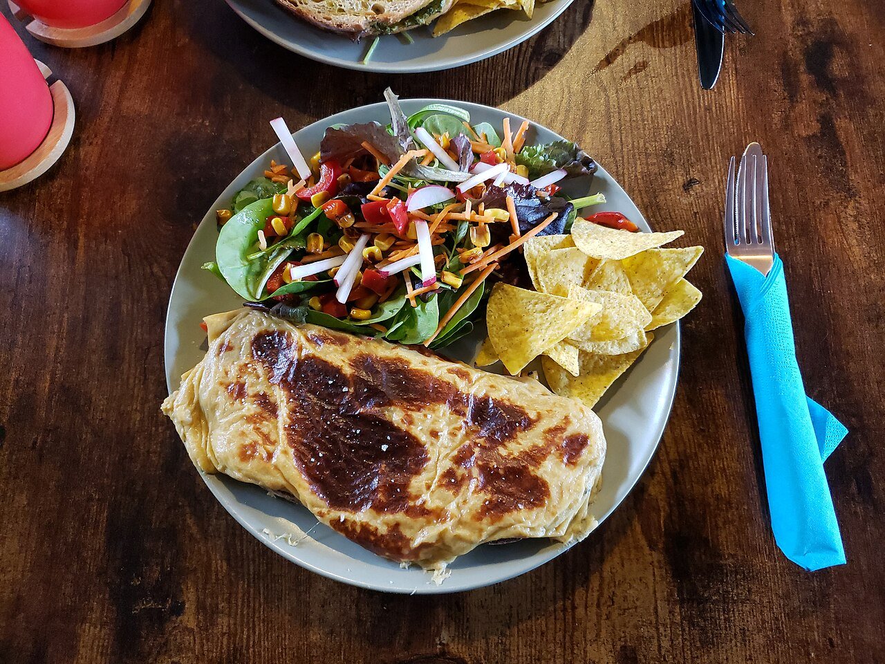 Representative photograph of Welsh Rarebit. The photograph includes salad and crisps not included in this draft.